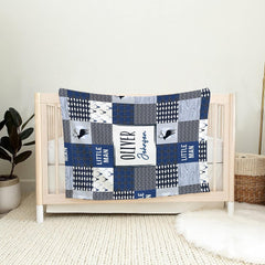 Woodland throw blanket draped over vintage wooden rocking chair in rustic cabin nursery