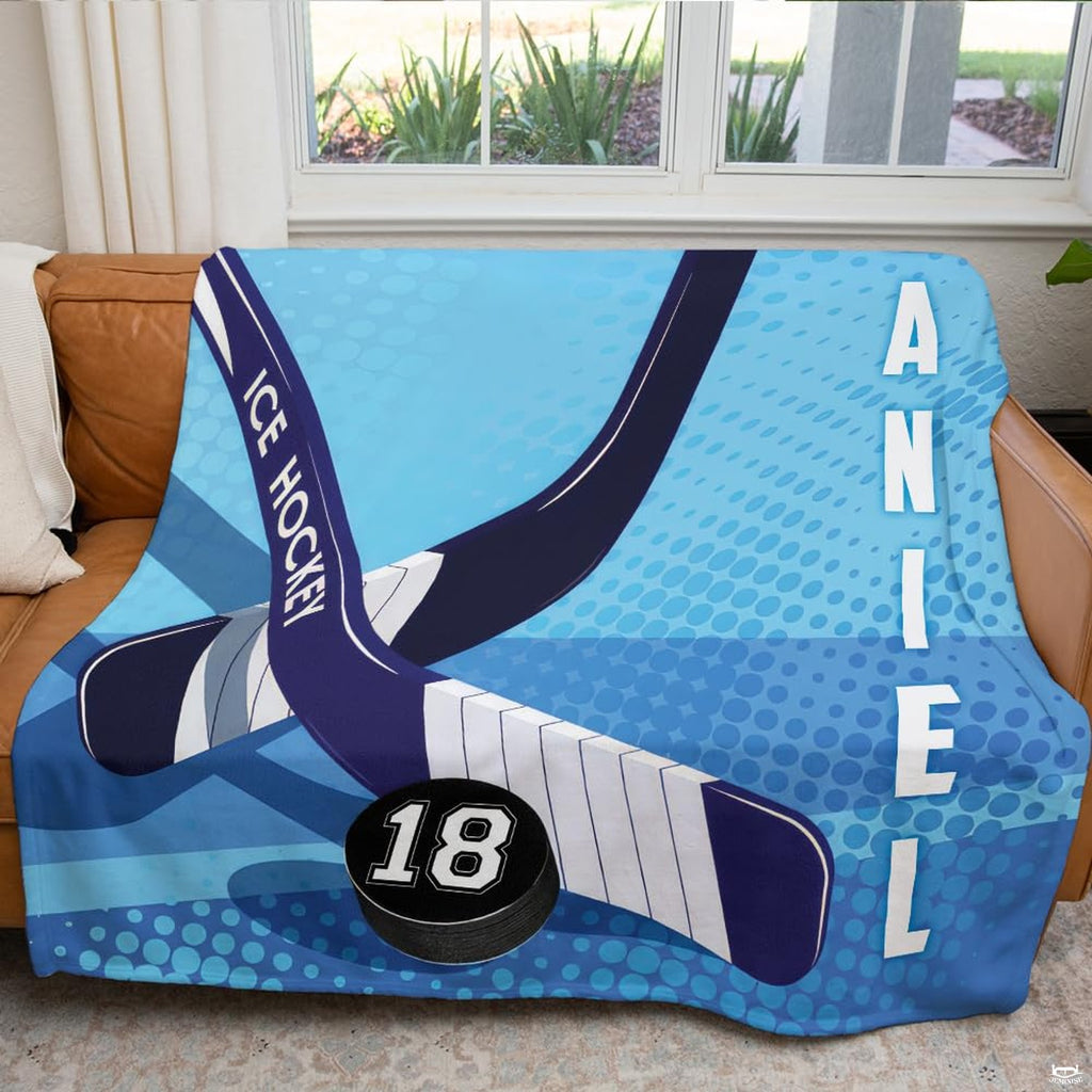 Close up shot showing fine graphic details and white underside of hockey sticks and puck blanket.