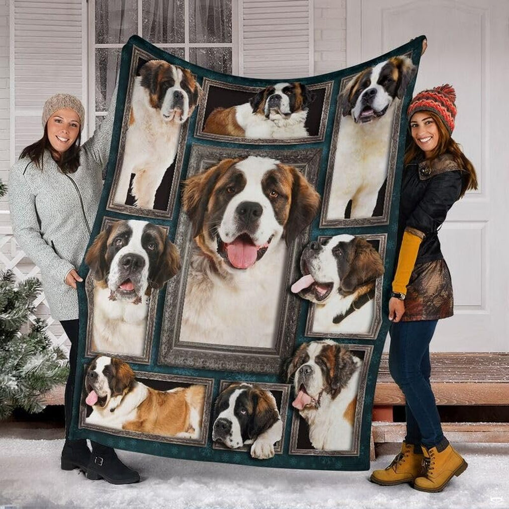 Two models displaying the Saint Bernard blanket outside a snowy winter home entrance.