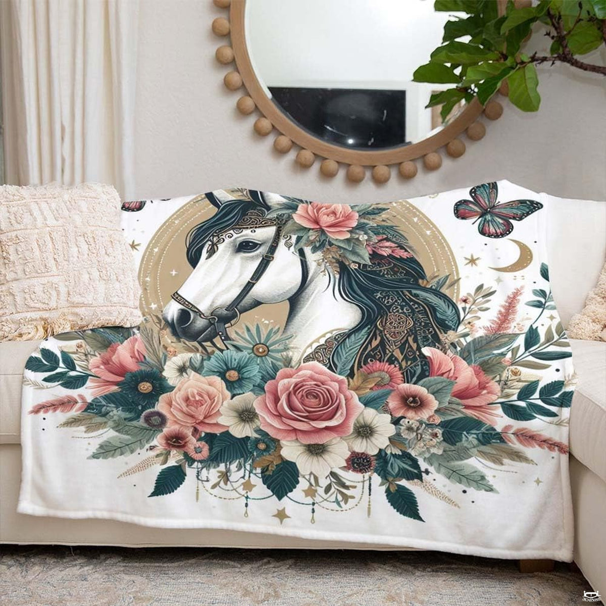 Close-up of celestial floral horse bedding graphic highlighting crescent moons, butterflies, and beaded motifs.