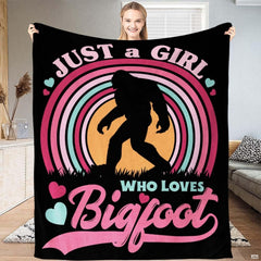 Pastel rainbow arch framing Bigfoot silhouette with hearts and typography on black, view 1.