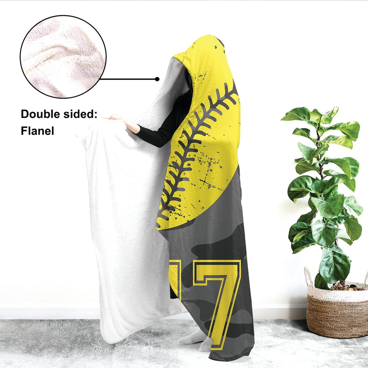 Close up of camo softball throw blanket highlighting yellow softball seams and urban camo print