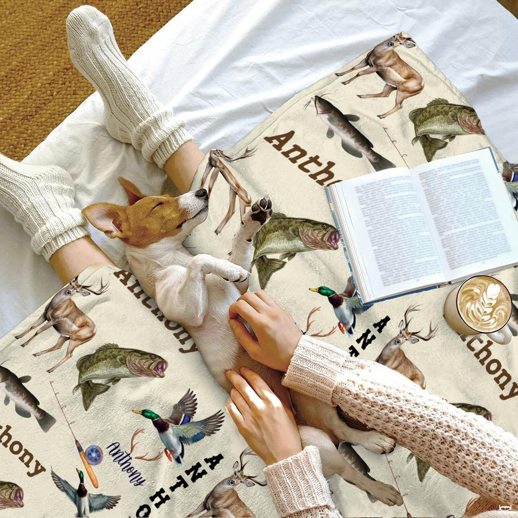 Rustic wildlife hunting and fishing throw blanket styled in a cozy lifestyle bed setting