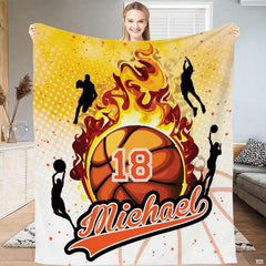 Bedding display showcasing bold flaming basketball motif and dynamic court outlines in a modern bedroom setting.