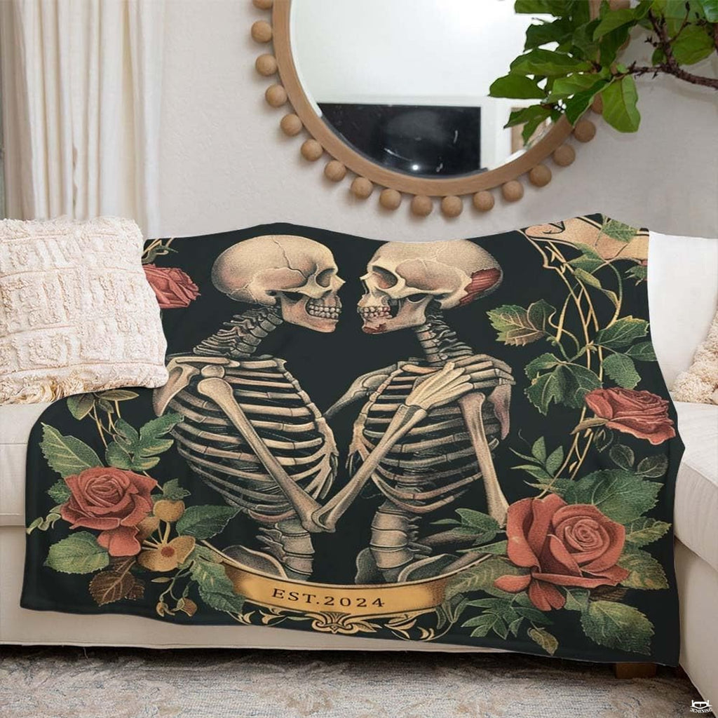 Gothic skeleton couple throw blanket view 4 highlighting embracing skeletons, blooming roses, and banner accents