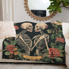 Gothic skeleton couple throw blanket view 4 highlighting embracing skeletons, blooming roses, and banner accents