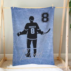 Close view of player silhouette artwork with hockey stick and jersey graphic accents