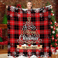 Buffalo plaid Christmas tree snowflake blanket held before tree