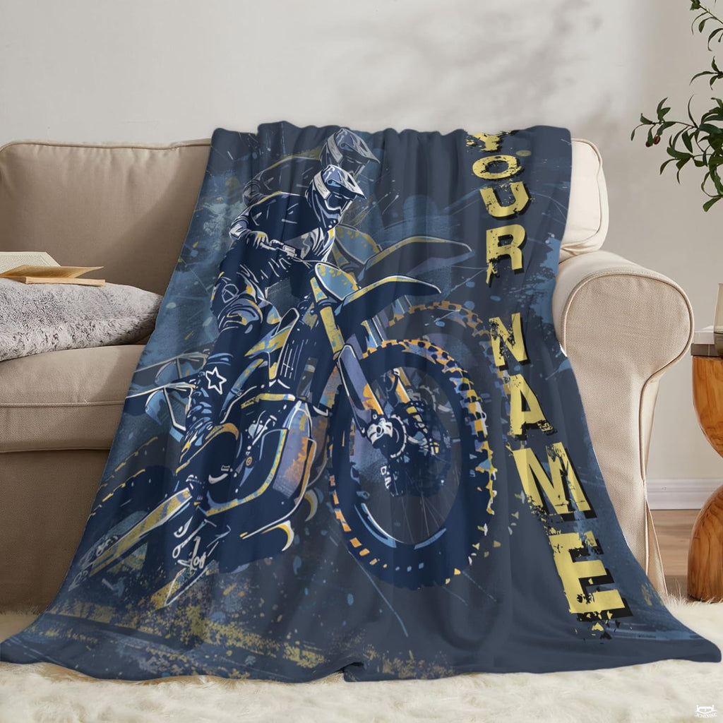 Extreme sports dirt bike throw blanket folded on wooden bench