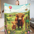 Pastoral painting of Highland cow and calf in wildflower field with hot air balloon, view 1.