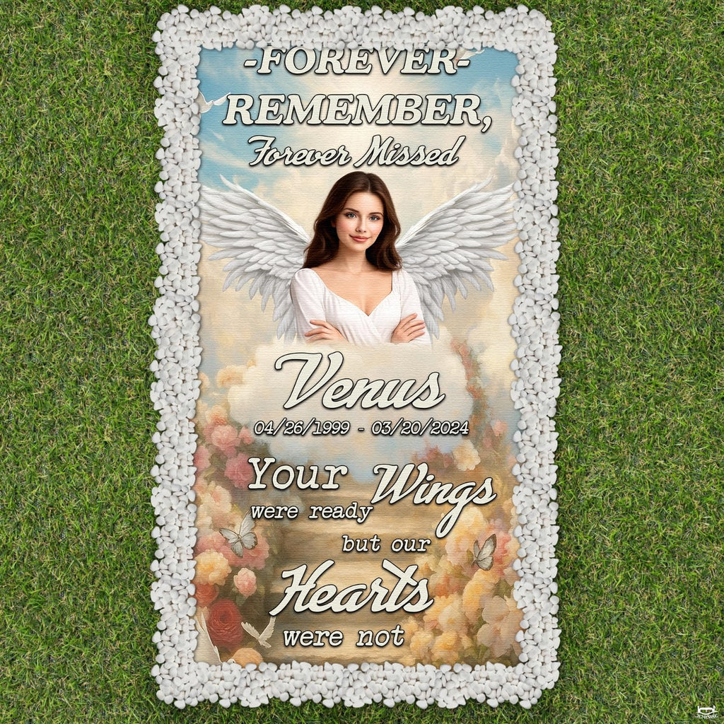 Folded display of memorial tribute grave blanket showing corner grommets and print texture.