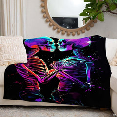 Folded corner view of neon skeleton throw blanket showing bright color drips