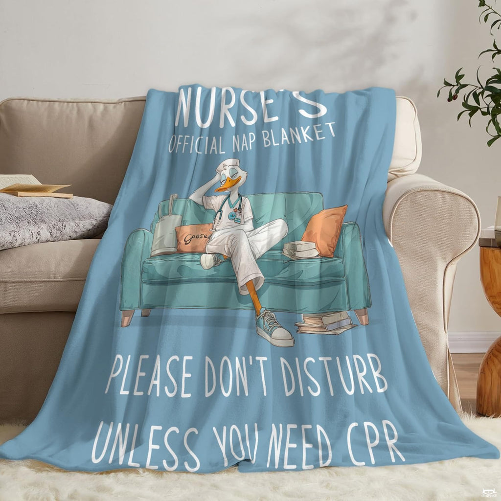 Angle view of nurse duck cartoon throw blanket showing crisp edges and pale blue background
