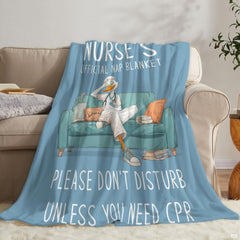 Angle view of nurse duck cartoon throw blanket showing crisp edges and pale blue background