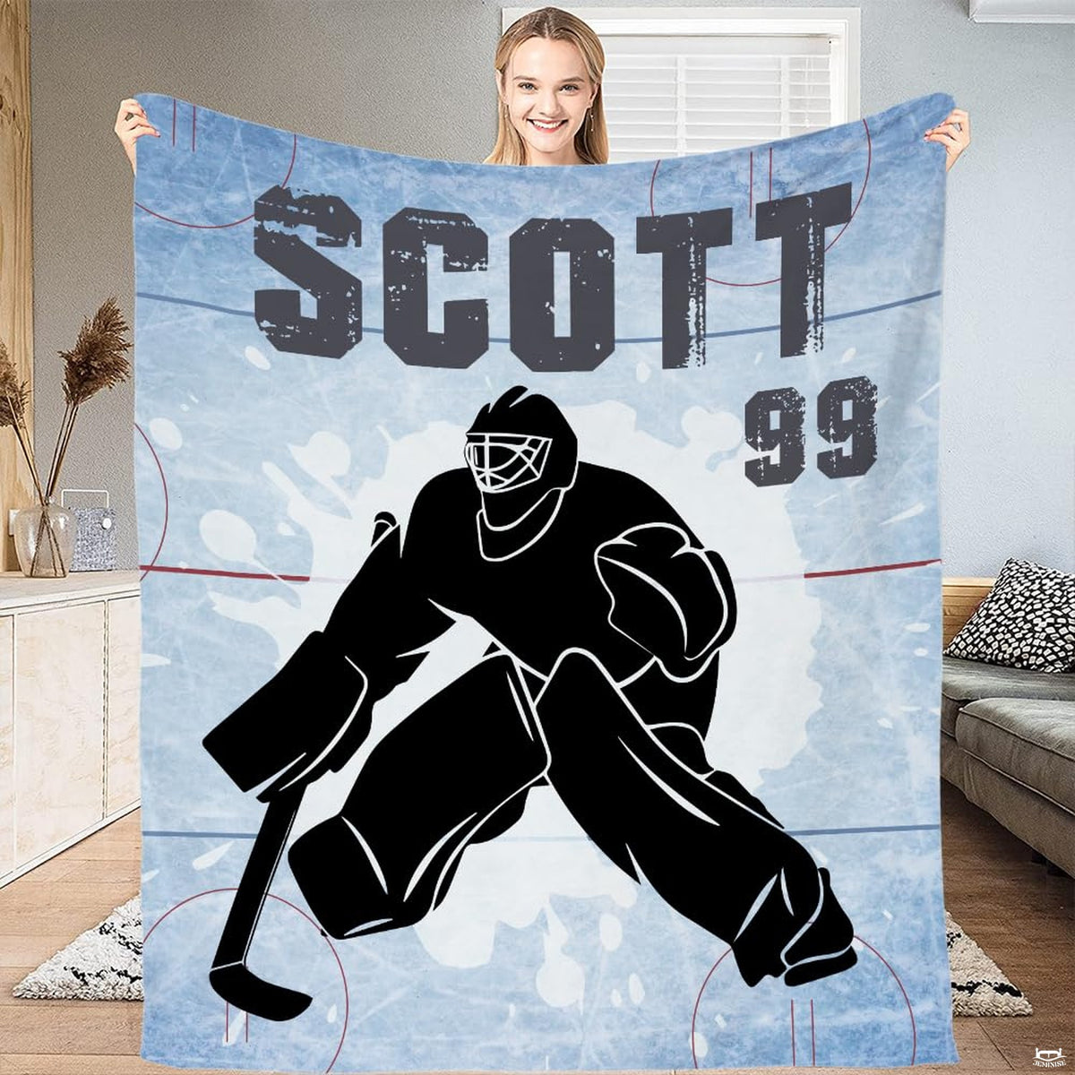 Full flat view of hockey goalie throw blanket showing distressed varsity lettering and rink lines.