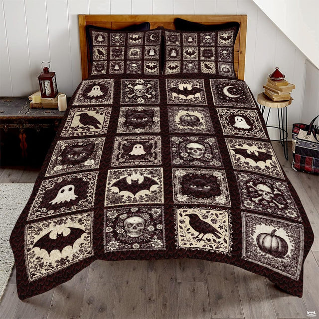 Gothic halloween bedding featuring patchwork panels with skulls, ravens, bats, and ghosts in dark espresso cream tones.