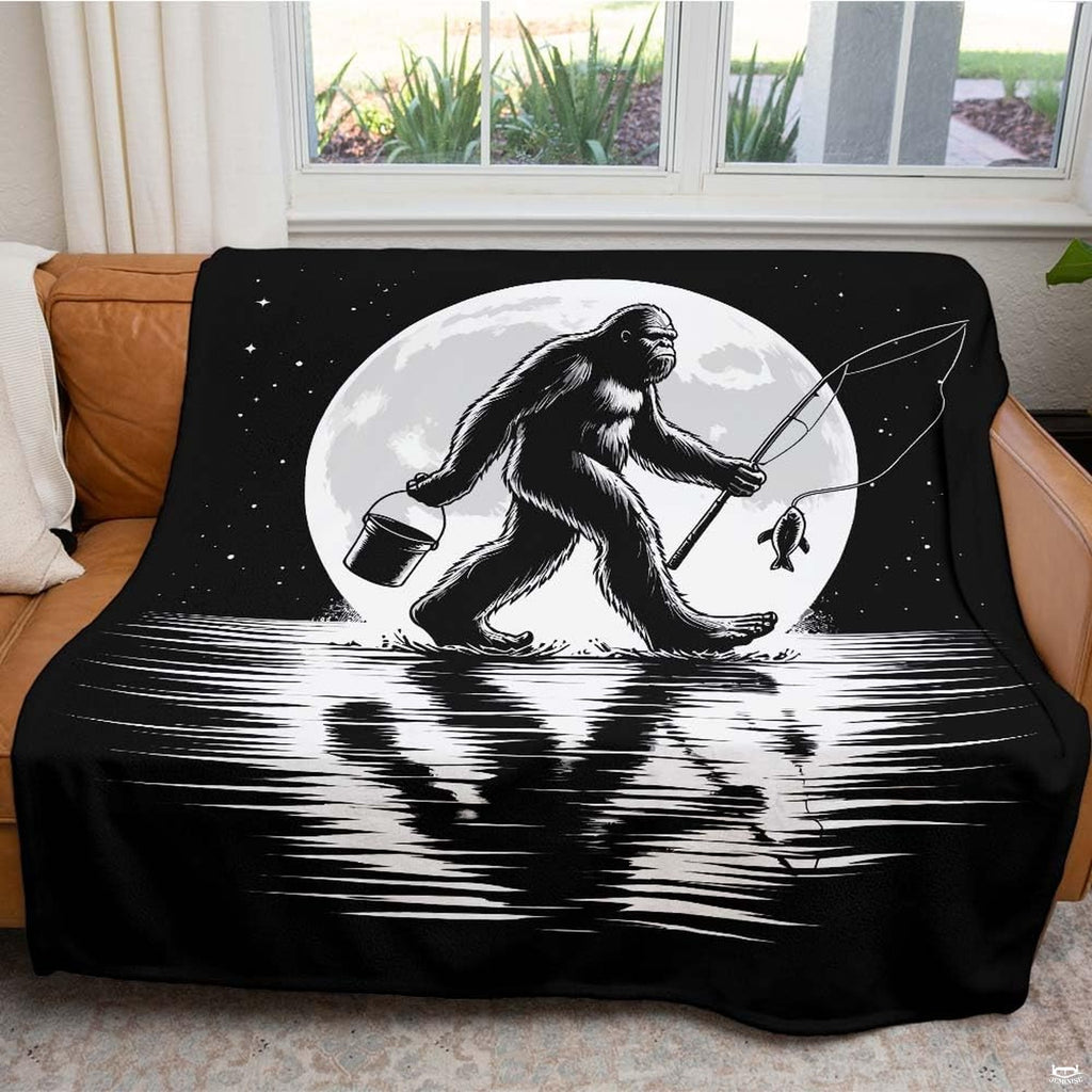 Monochrome illustration of Bigfoot fishing with rod and bucket under full moon on reflective lake, view 3.