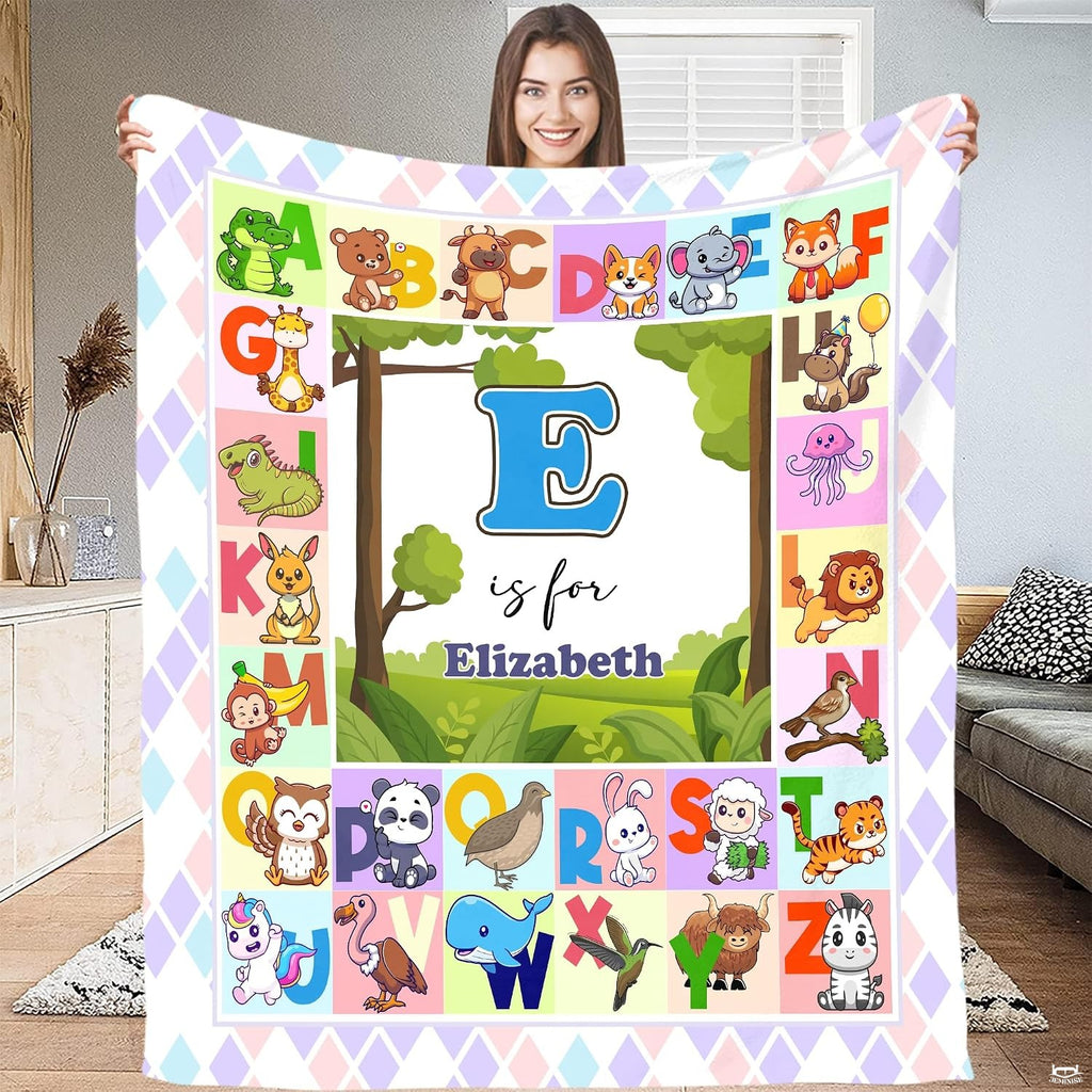 Illustrated A to Z cute animal alphabet chart surrounding central woodland meadow landscape, view 2.