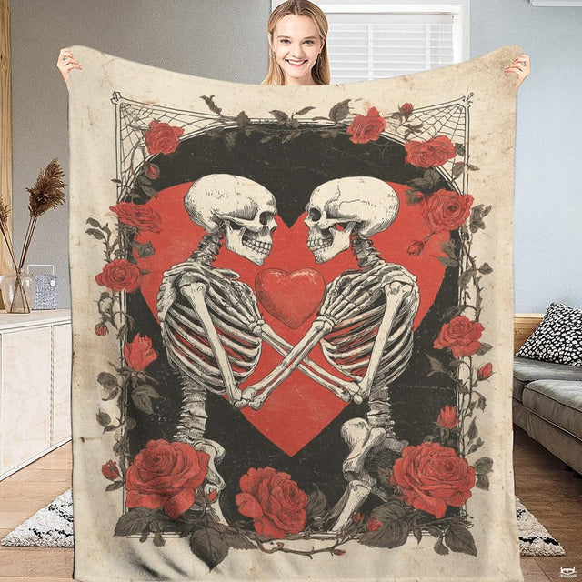 Vintage rose bedding featuring embracing skeletons and red heart artwork in a gothic bedroom setting.