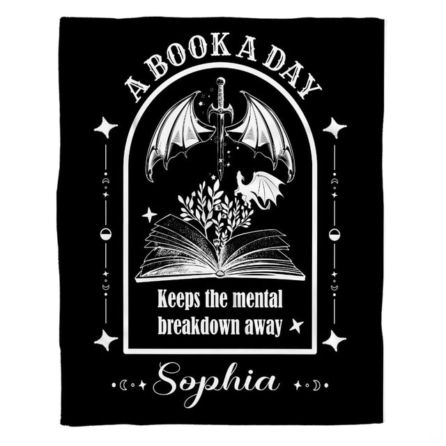 Living room display showing gothic monochrome fantasy throw blanket styled on neutral furniture.