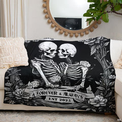Antique baroque rose accents and romantic skeleton illustration on a dark bed display.