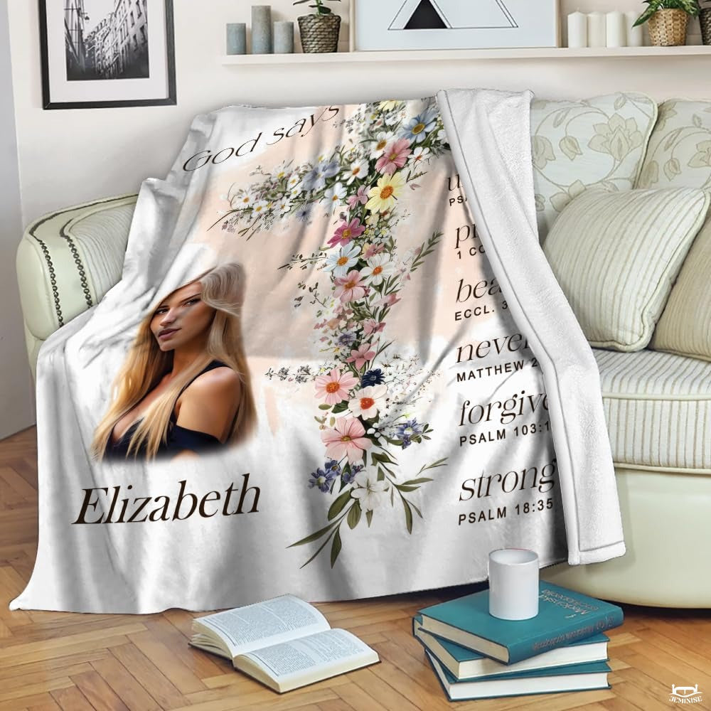 Floral cross scripture affirmations blanket draped over living room armchair beside reading books.