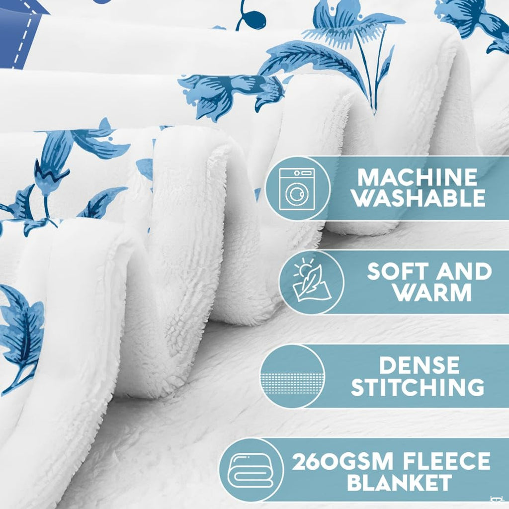 Blue floral scripture acrostic affirmation throw blanket styled over a contemporary living room sofa
