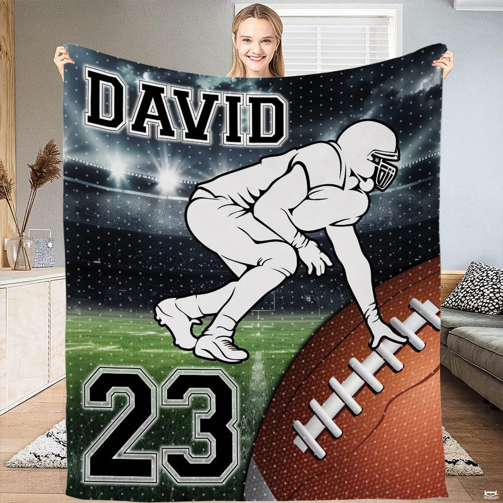 Football lineman stance stadium throw blanket displaying player on green turf under arena lights
