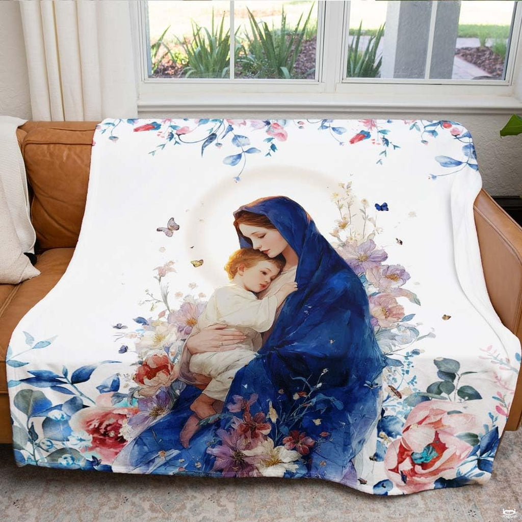 Madonna and Child blanket draped across an armchair beside a brightly lit window.