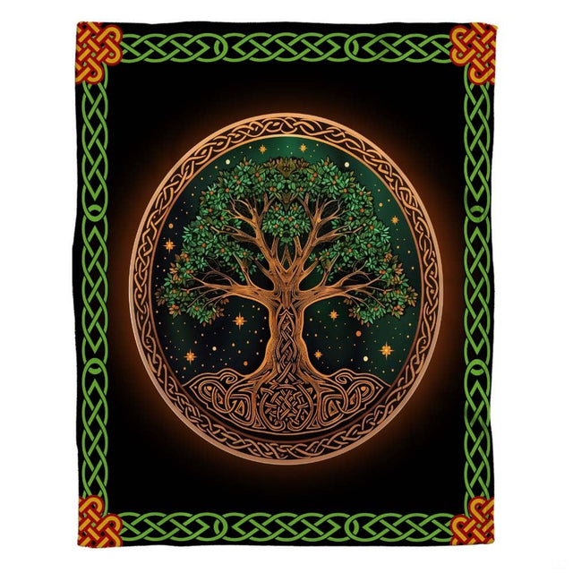 Woman holding open Celtic Tree of Life throw blanket showing green knot border and orange corners