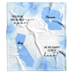 Living room decor setting featuring long distance friendship map throw blanket on modern couch