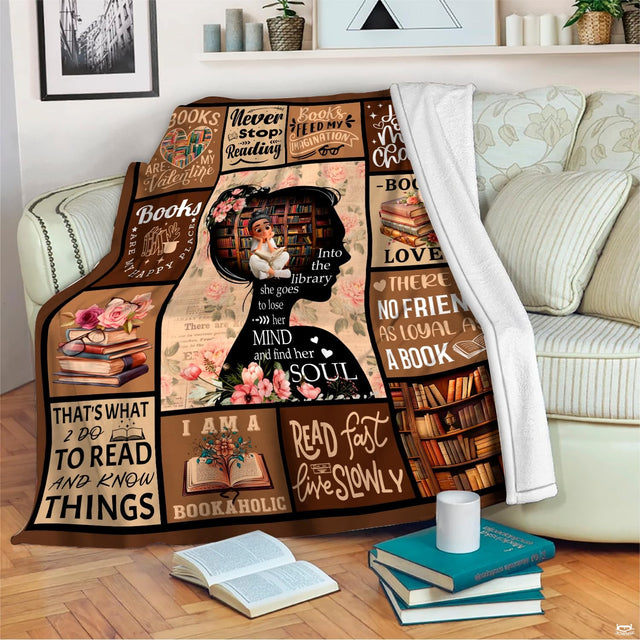 Living room sofa display showing the book lovers blanket draped neatly beside decorative accent pillows.