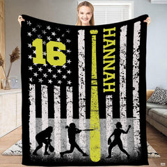 Person standing in living room holding up the softball flag print with neon bat accent.