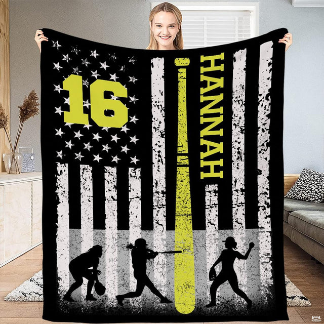 Person standing in living room holding up the softball flag print with neon bat accent.
