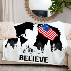 Bigfoot silhouette with rock hand sign, American flag, pine trees, and bold typography, view 4.