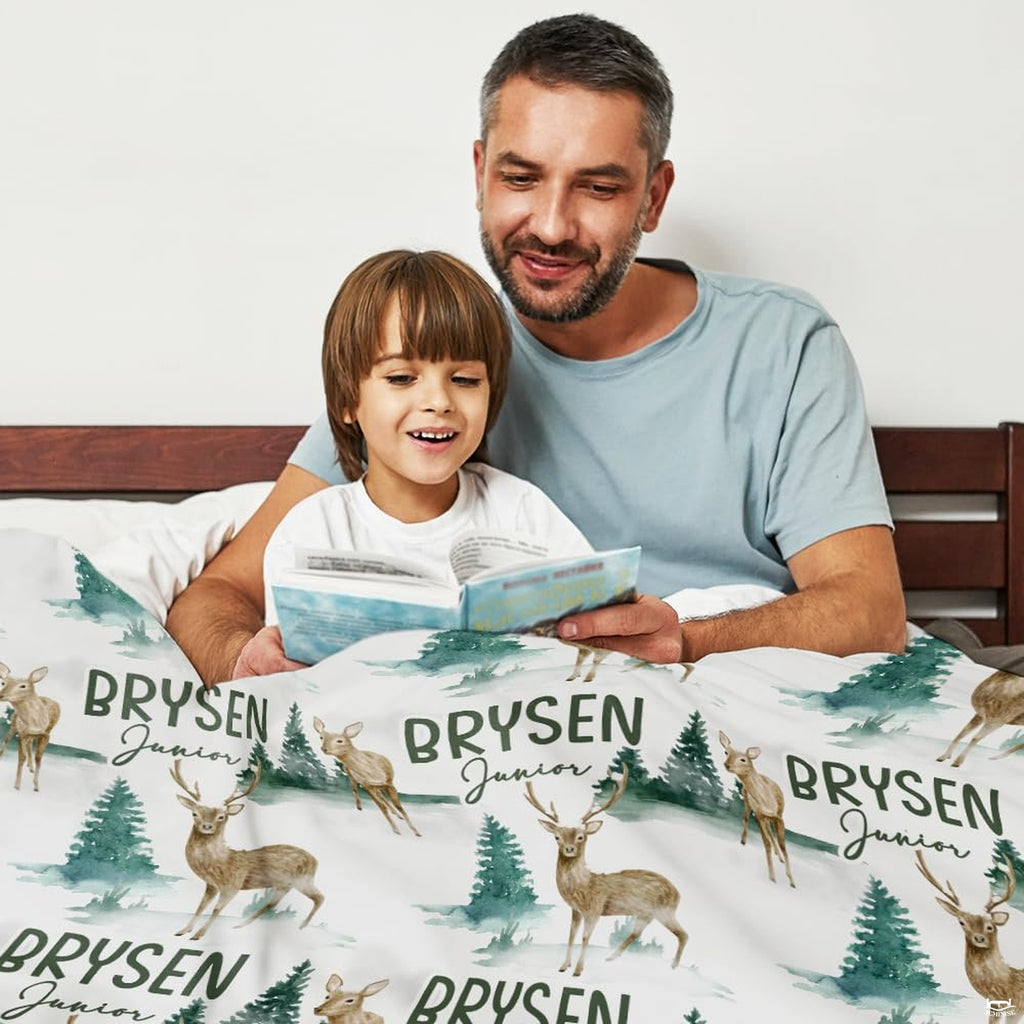Detailed view of forest green evergreen trees and wildlife pattern on bright bedding.