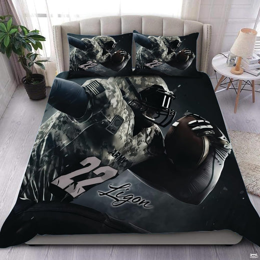 Midnight navy football sports bedding featuring textured football graphic and yard lines on a bed