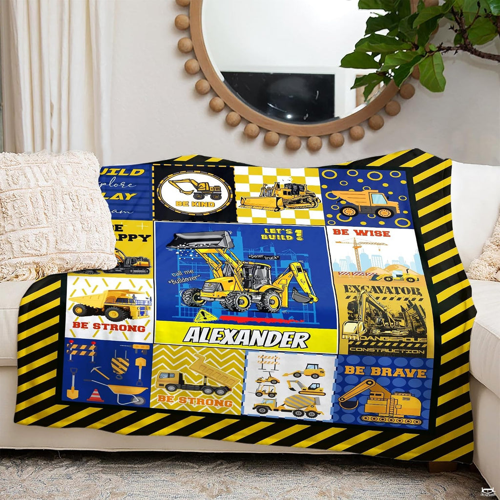 Overhead perspective of kids excavator bedding artwork surrounded by black and yellow borders.