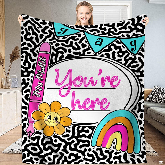 Cow print bedding set featuring monochrome spots, vivid pink ribbon accents, and smiling retro flower artwork.