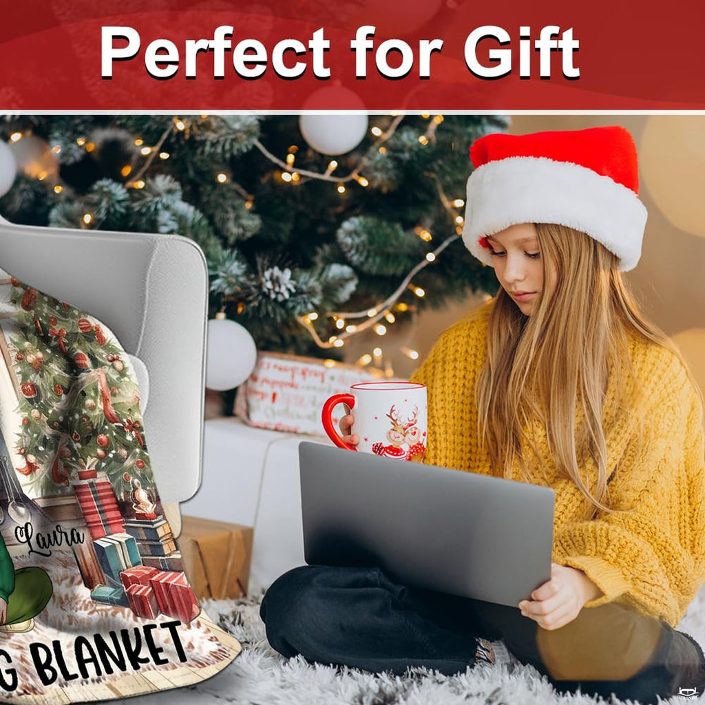 Holiday lifestyle scene displaying Christmas movie throw blanket beside a decorated tree.