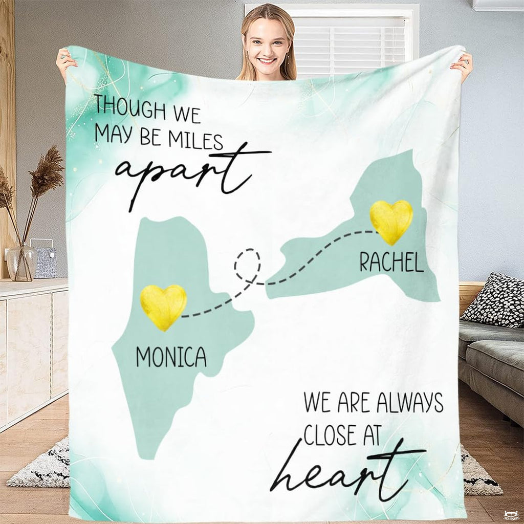 Folded throw blanket display showing mint state silhouettes and golden textured location markers.