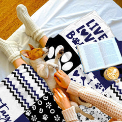 Navy dog paw print throw blanket view 5 highlighting patchwork pattern squares, bones, and stripes