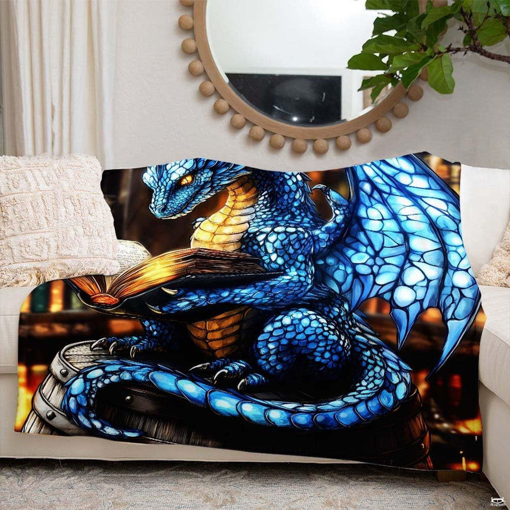 Lifestyle setting displaying the dragon reading throw blanket neatly folded on an armchair.