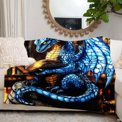 Lifestyle setting displaying the dragon reading throw blanket neatly folded on an armchair.