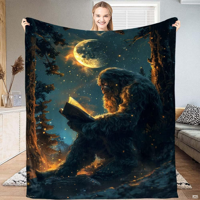 Reading Bigfoot forest night throw blanket featuring Sasquatch reading glowing book under full moon