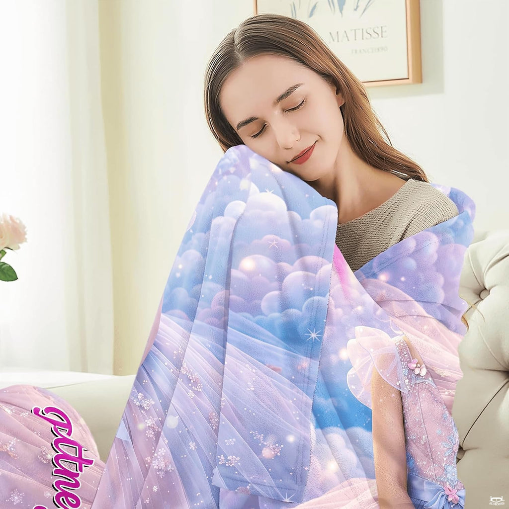 Fairytale portrait blanket shown spread out displaying full cloud and rainbow illustration.