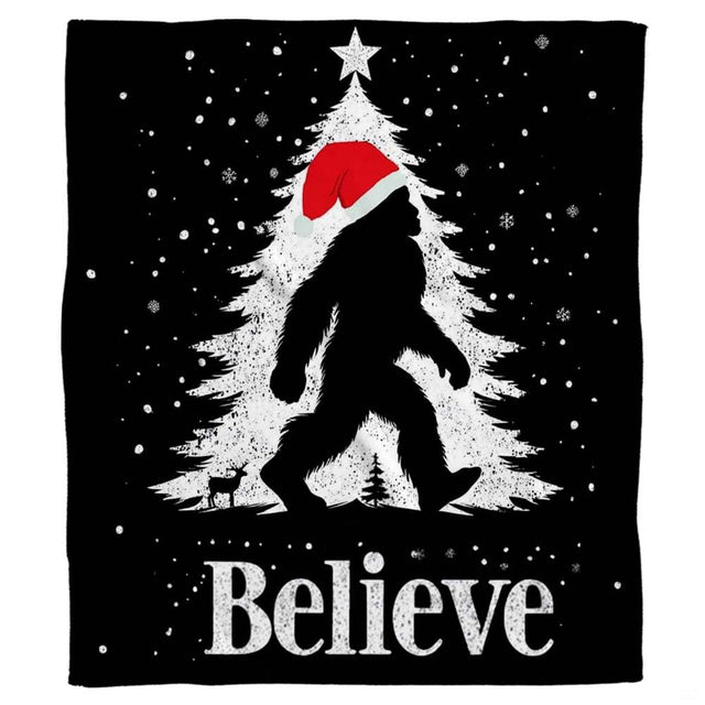 Christmas Bigfoot throw blanket view 2 highlighting Santa hat silhouette, falling snow, and festive tree