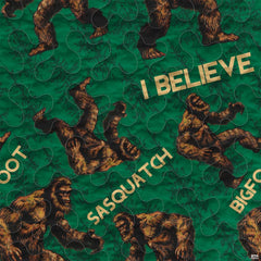 Close-up of the detailed woodland creature and golden lettering on a green botanical bedding set