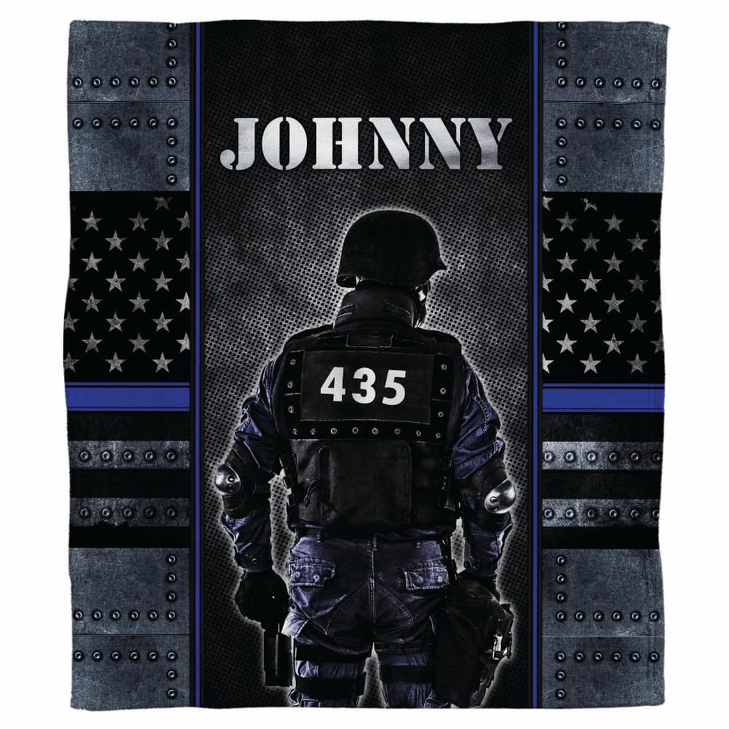 Tactical police officer armor graphic blanket draped across sofa