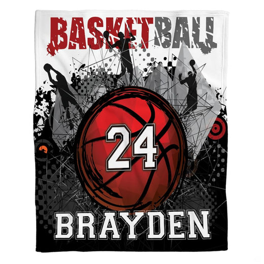 Basketball bedding set featuring basketball player silhouettes and paint splatter artwork on a bed.